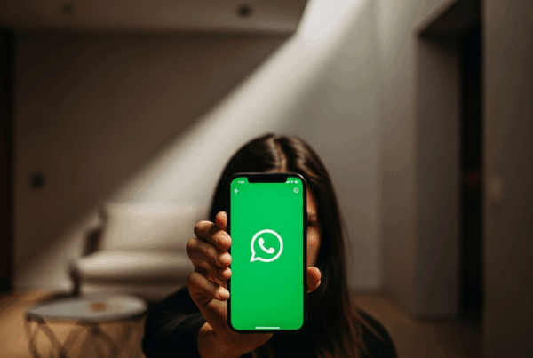 - in the Generate a of a person hiding behind a smartphone with WhatsApp open in a modern mi